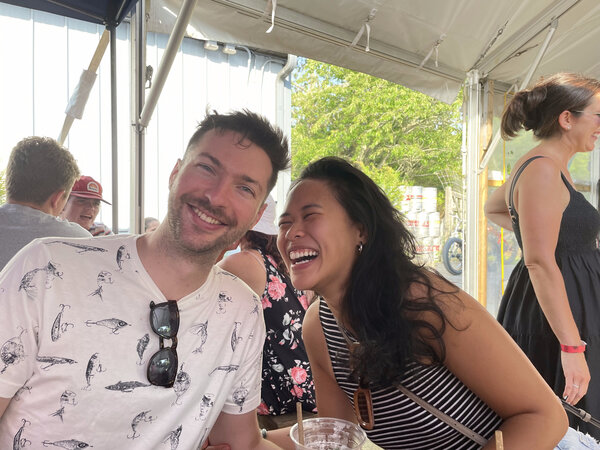 Derek and Nhi laughing together