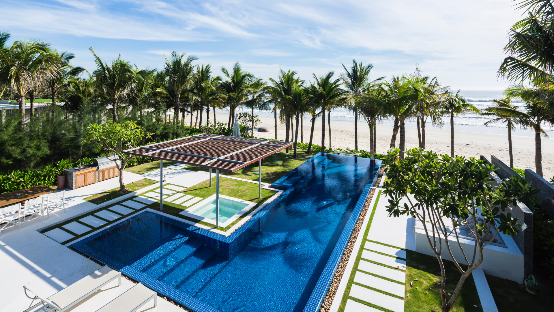 Aerial view of the pool and beach at Naman Retreat, Da Nang