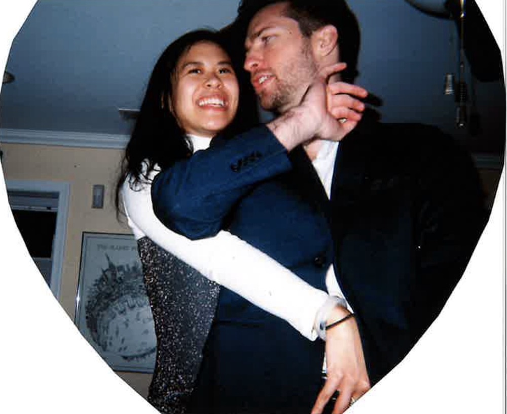 Nhi and Derek in a heart-framed film photo